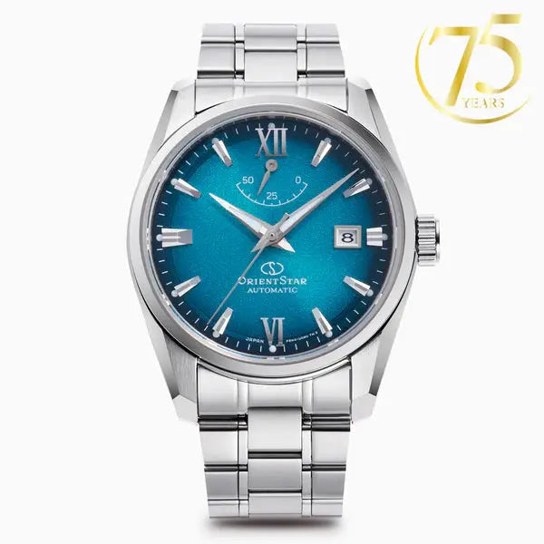 Silver watch with blue face on a white background, featuring the Orient Star brand.